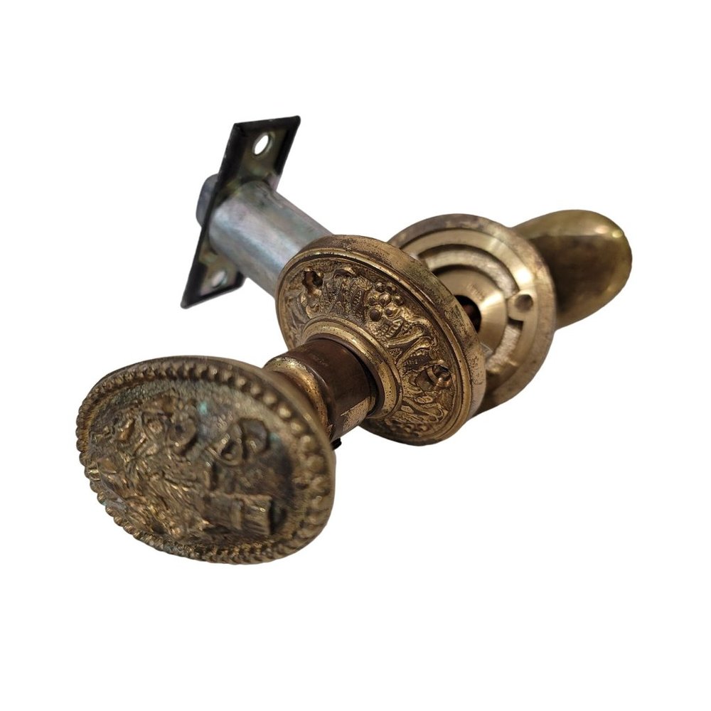 antique brass neoclassical ornate oval rosset door knob gold color